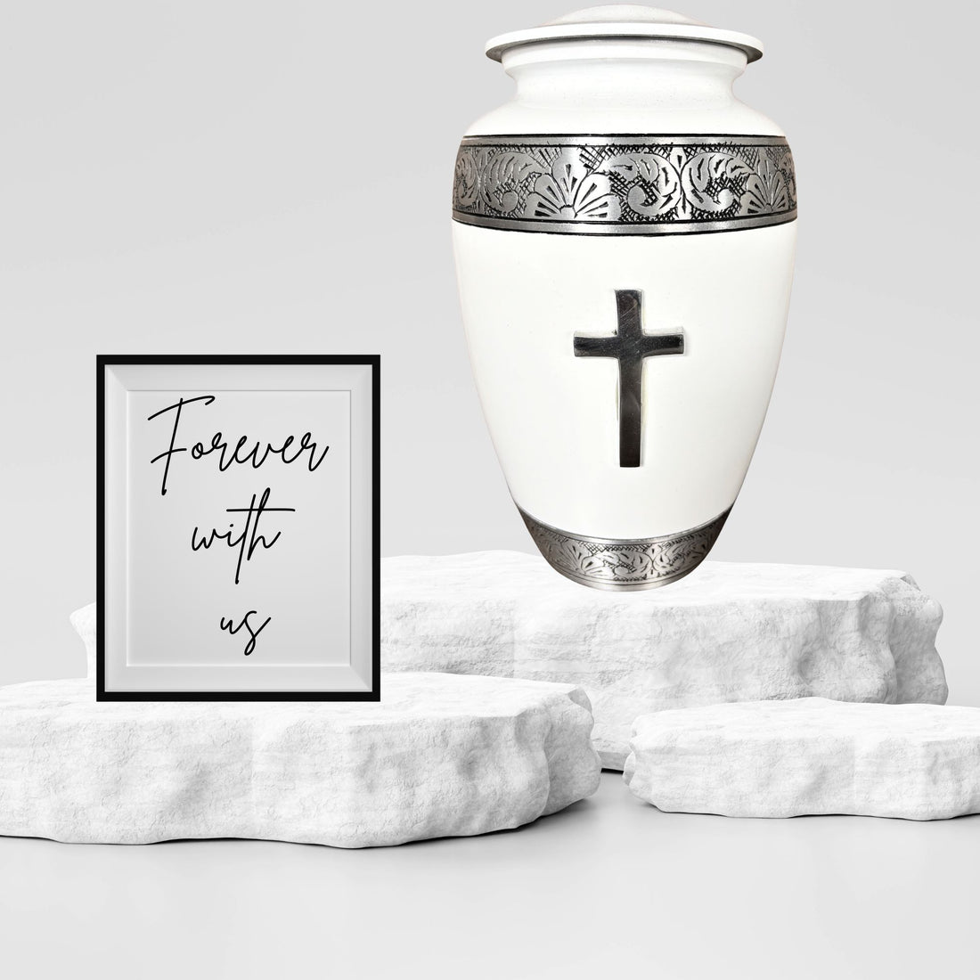 White urn with silver decorative band and cross on a white background