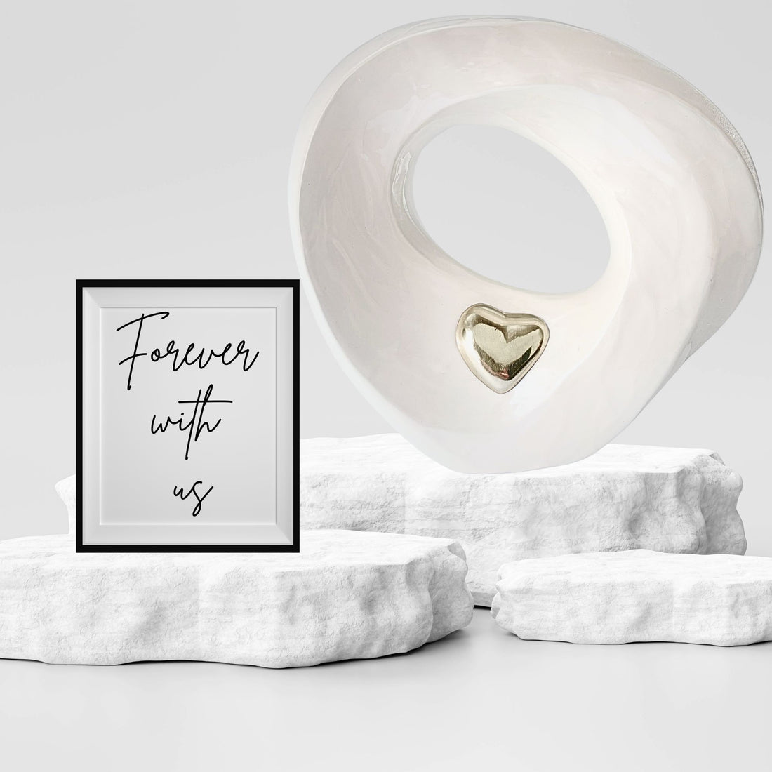 White ceramic ring Urn with a gold heart-shaped inset on a white background