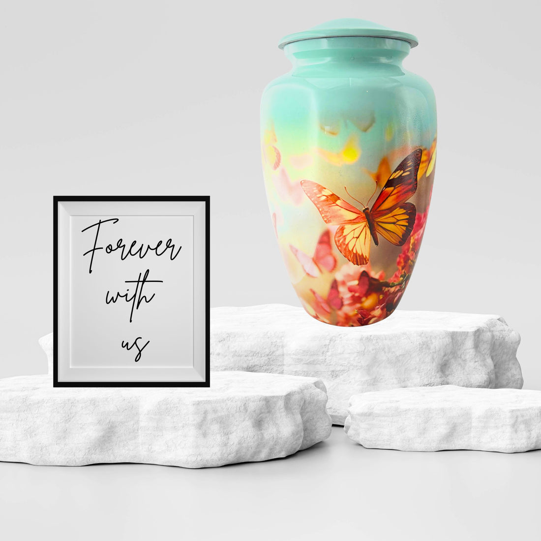 Metallic urn with butterfly design on a white background