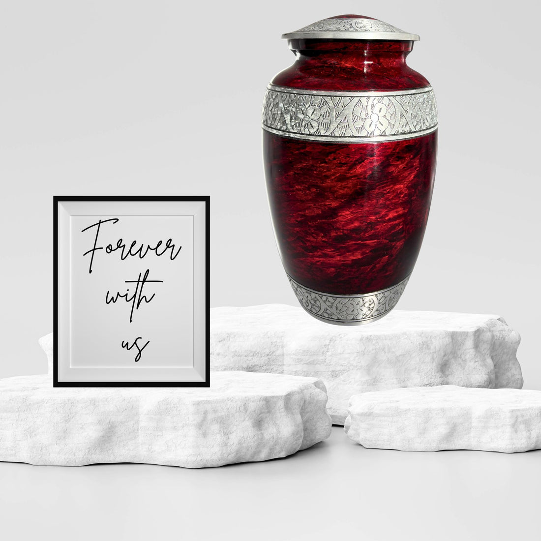 Red urn with silver decorative band on a white background