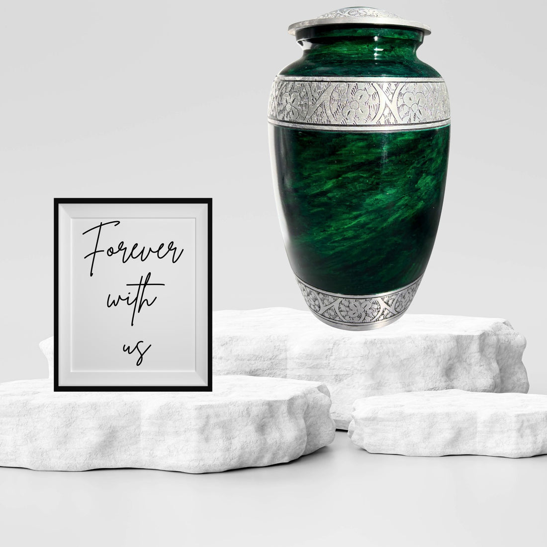 Green urn with silver decorative elements on a white background