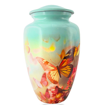 Metallic urn with butterfly design on a white background