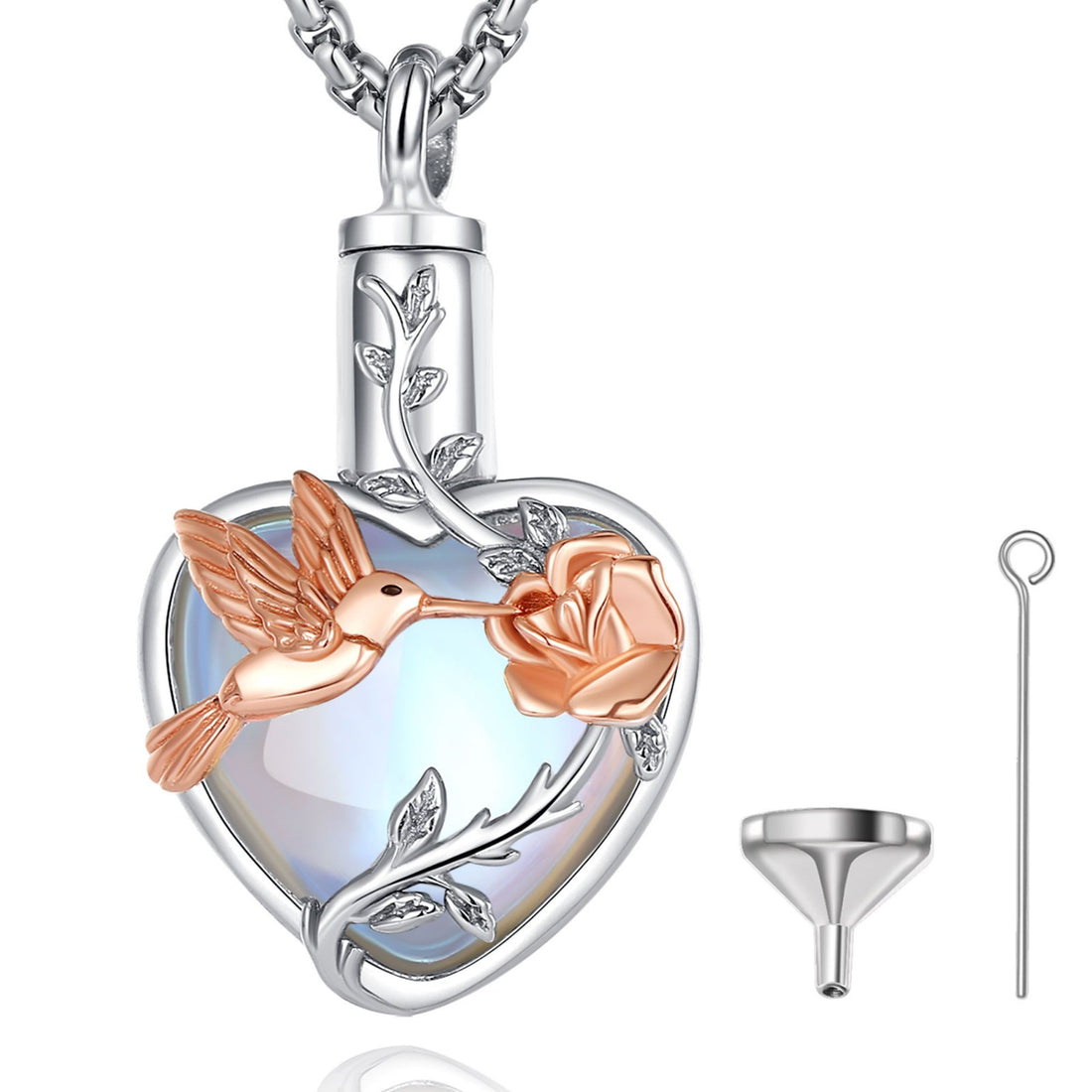 Heart-shaped pendant with hummingbird and rose design on a white background