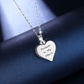 Heart-shaped silver pendant with 'Forever In My Heart' engraving on a dark blue background