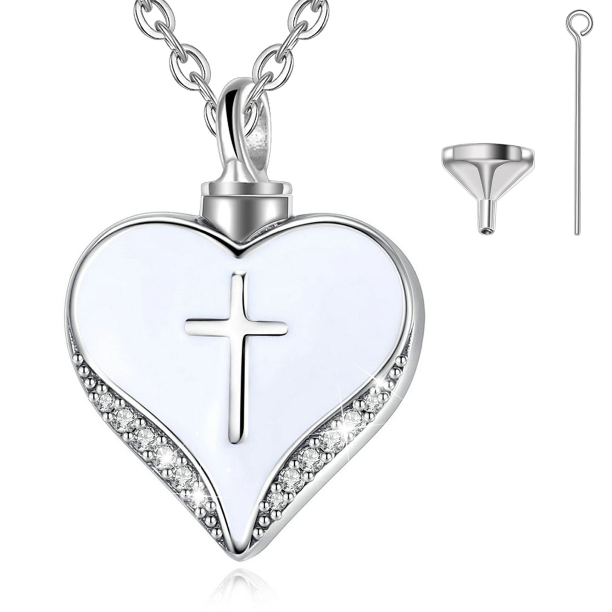 Heart-shaped pendant with cross design on a white background
