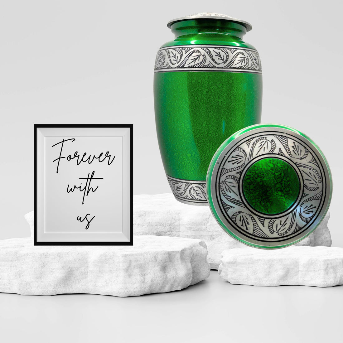 Green urn with silver decorative band on a white background