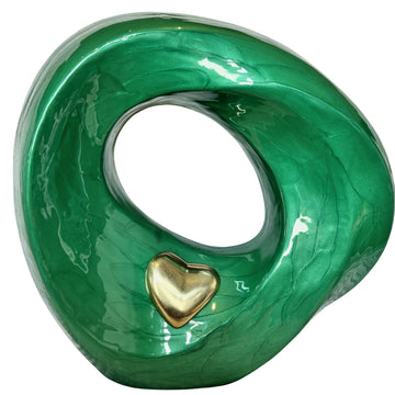 Green marble-textured object with a gold heart on a white background