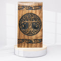 Wooden box with tree of life design on a white background