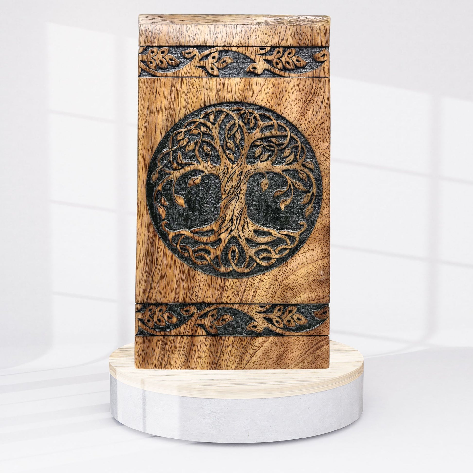 Wooden box with tree of life design on a white background
