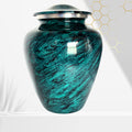 Teal marbled urn with silver lid on a white background