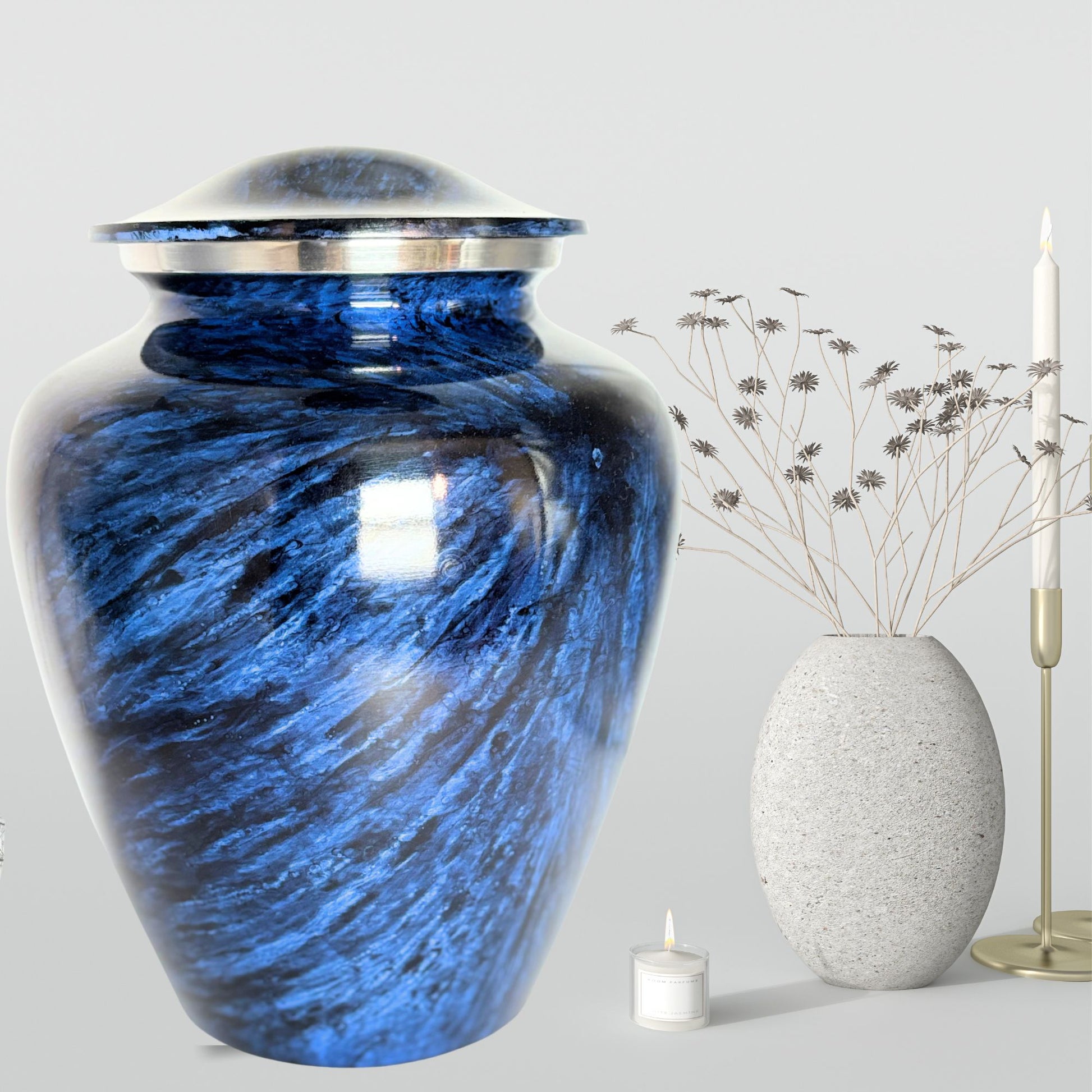 Blue urn with a silver lid on a gray background