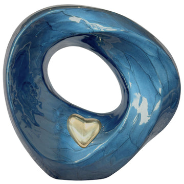 Blue metal urn with golden with a heart-shaped cutout on a white background