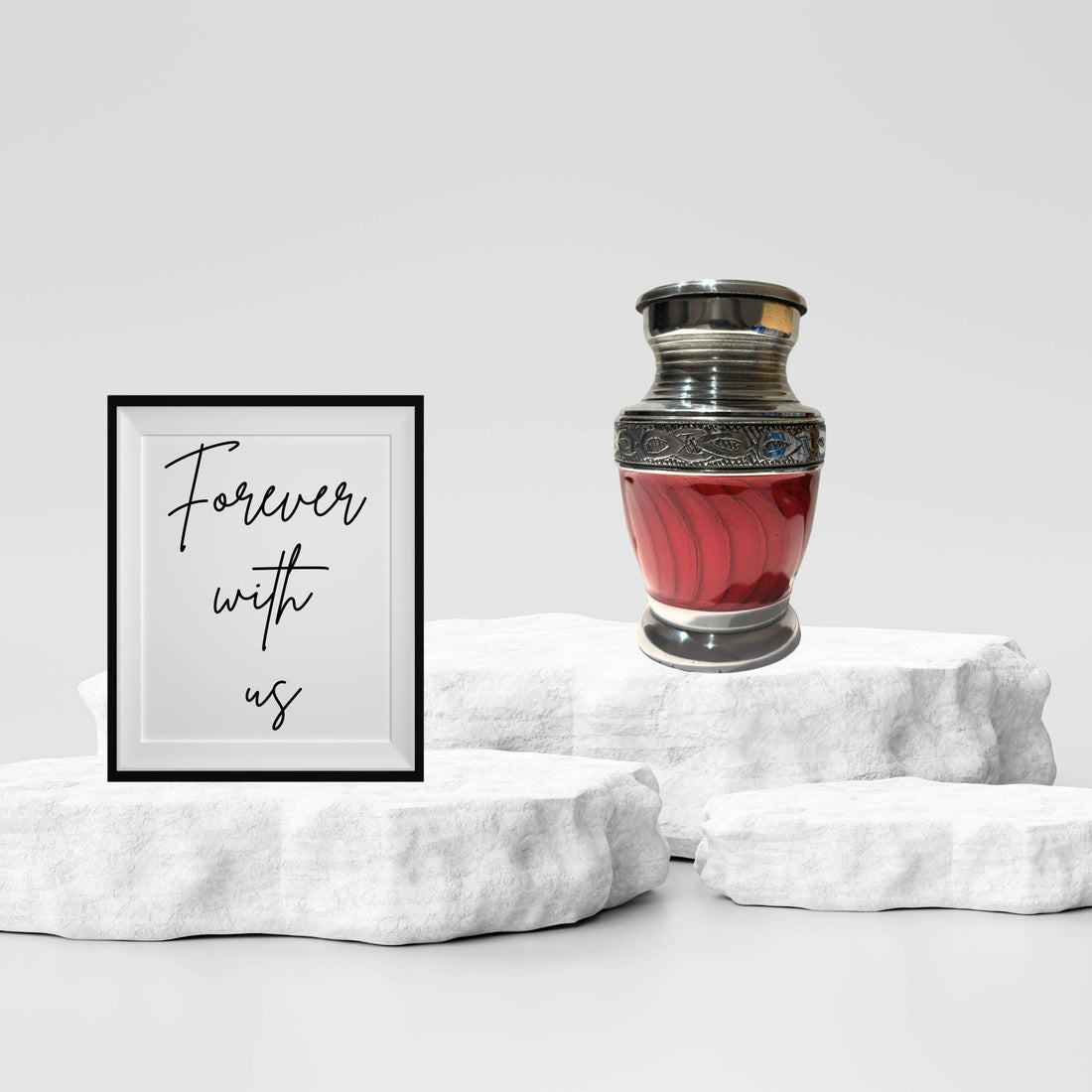 Red urn with silver decorative elements on a white background