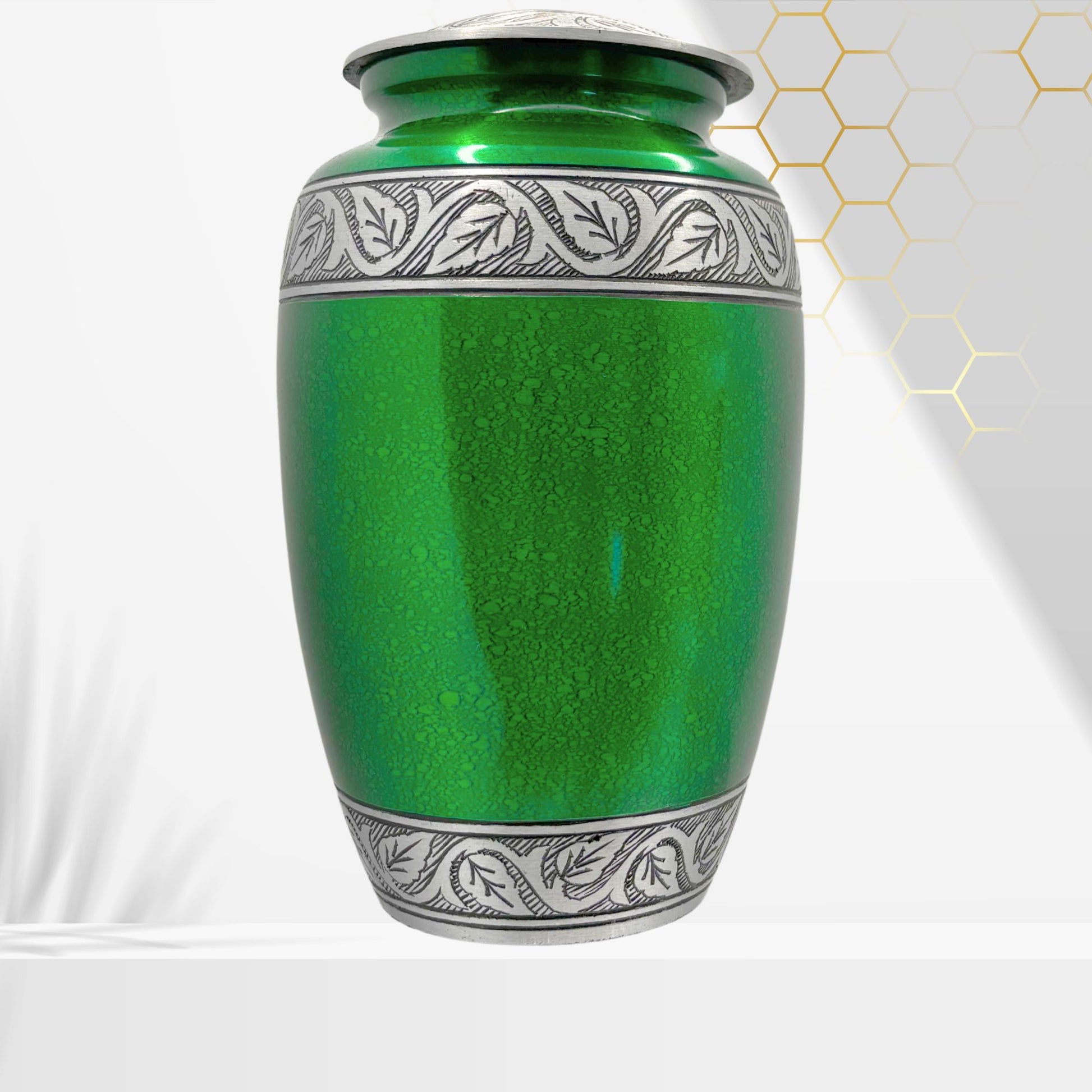 Green urn with silver decorative band on a white background