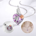 Heart-shaped necklace with purple crystal and silver bird design on a white background