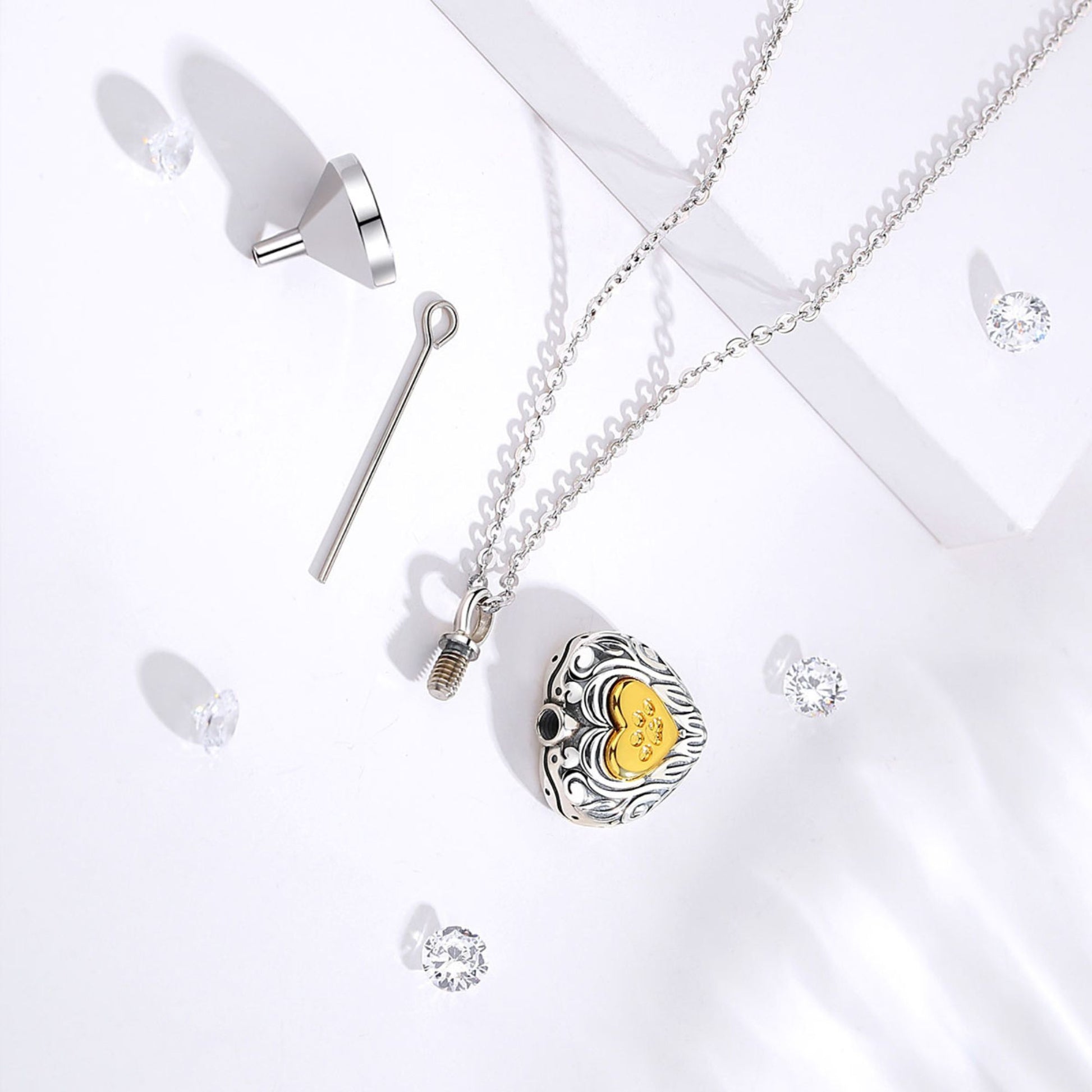 Silver necklace with a yellow pendant on a white background