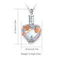Heart-shaped pendant with a hummingbird and rose design, shown with measurements and weight on a white background.