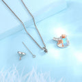 Heart-shaped pendant with chain on a light blue background