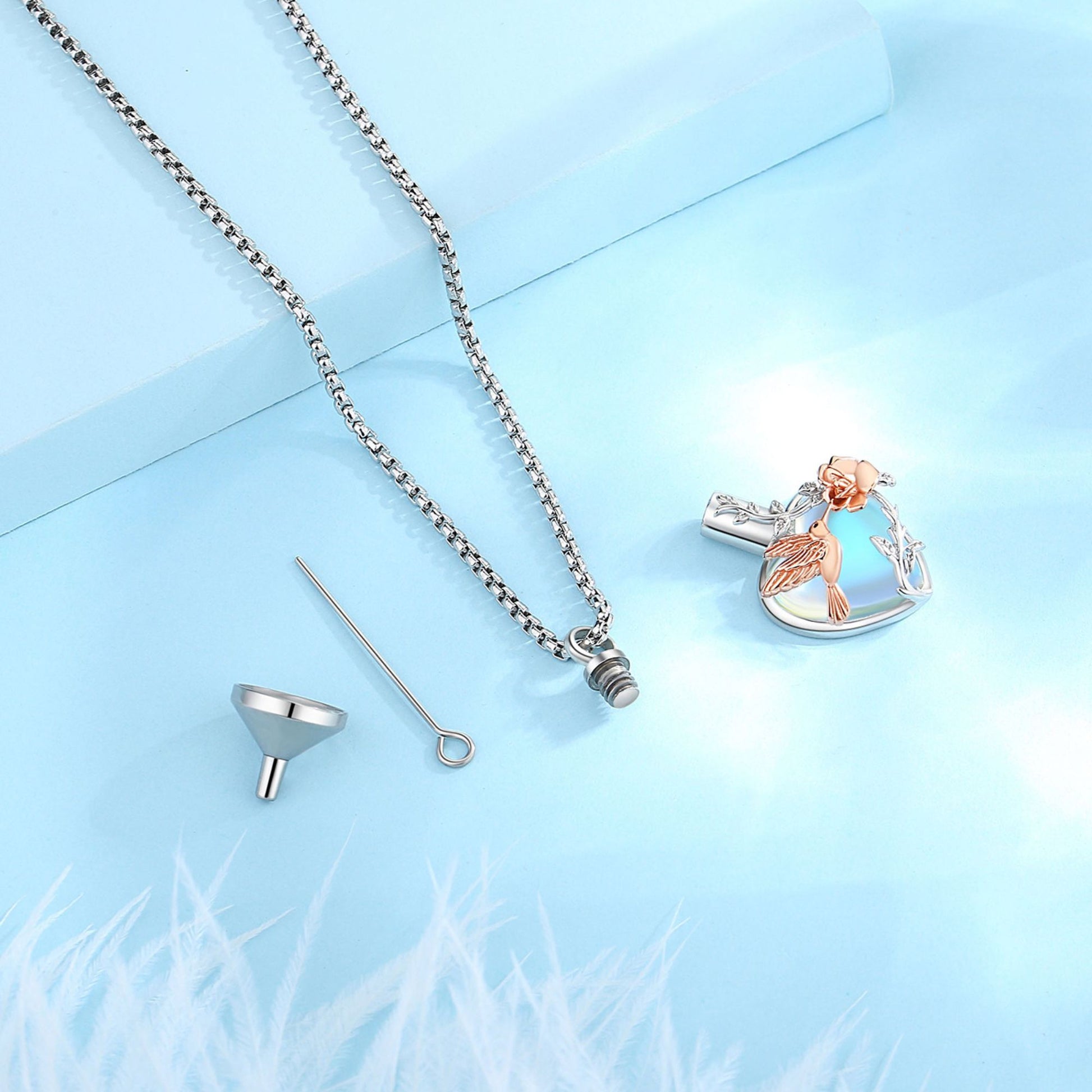 Heart-shaped pendant with chain on a light blue background