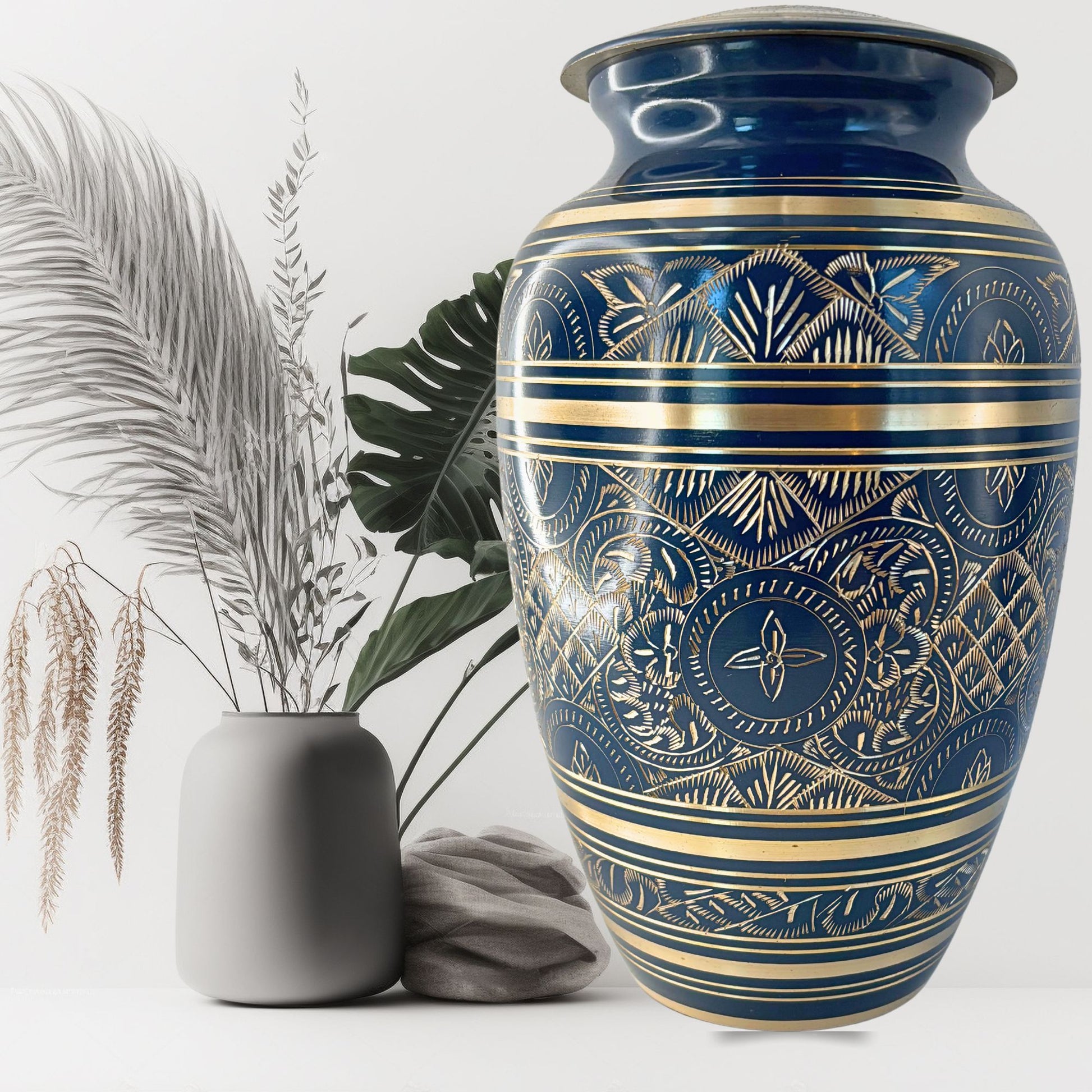 Decorative blue and gold urn with a plain background