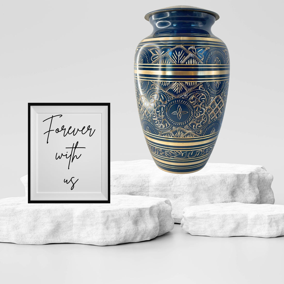 Blue urn with gold and white patterns on a white background