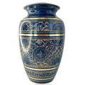 Blue urn with gold and white patterns on a white background