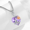 Heart-shaped purple pendant with a rose design on a white background